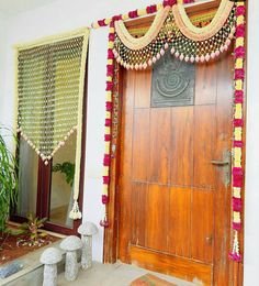 an entrance decorated with flowers and decorations