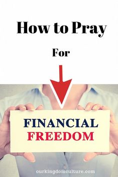 a woman holding up a sign that says how to pray for financial freedom