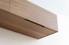 a close up view of a wooden object on the side of a wall or ceiling