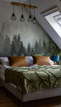 a large bed sitting under a skylight in a bedroom next to a wooden floor