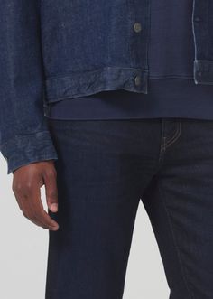 Our trimmest option, tailoring the slim to offer a trimmer look from the knee down while offering room throughout the hip and thigh. This fit is true to size. Looks Like: Deep and saturated clean indigoFeels Like: Signature perform denim blended with cashmere Fitted Dark Wash Bottoms With Straight Hem, Fitted Indigo Straight Leg Jeans, Fitted Straight Leg Indigo Jeans, Fitted Indigo Recycled Jeans, Fitted Recycled Indigo Jeans, Fitted Recycled Denim Jeans In Indigo, Fitted Straight Hem Denim Blue Jeans, Classic Fitted Recycled Denim Bottoms, Fitted Selvedge Denim Blue Bottoms