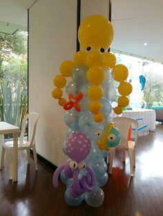 an octopus balloon tower in the middle of a room