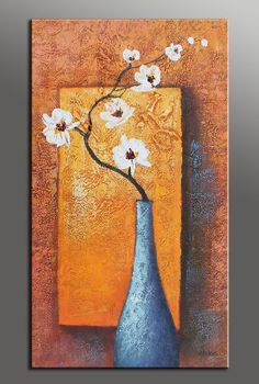 a painting of a blue vase with white flowers on an orange background is featured in the frame