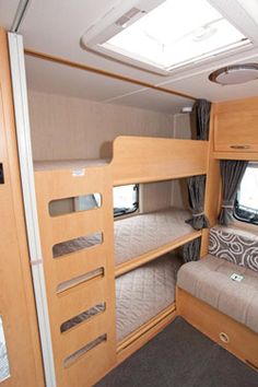 the inside of a camper with bunk beds