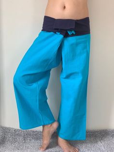 "Unisex Thai fisherman pants. One size fits all. You can wear in many occasions, casual wear, yoga wear, maternity wear, relax at home, travel etc. If you are looking for some pants that you can wear everywhere, comfortable, relax and Easy to wear. Thai fisherman pants is Answer!! Nice gift for yourself or your lover One pocket on the side for storing your items such as wallets, mobile phones, etc Approx. Measurements: One size can fits most and 1 Pockets Measurement Waist 27\" (69 cms) Length 4 Blue Cotton Bottoms For Relaxation, Comfortable Blue Pants For Relaxation, Blue Wide Leg Harem Pants For Loungewear, Cotton Yoga Pants For Meditation, Comfortable Blue Cotton Pants, Casual Blue Yoga Pants, Blue Wide Leg Cotton Harem Pants, Casual Blue Pants For Relaxation, Blue Cotton Yoga Pants For Summer