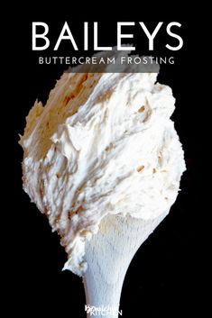 the cover of bailey's buttercream frosting, with a spoon full of whipped cream