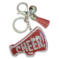 Add a touch of sparkle and team spirit to your game day essentials with this Red and Silver Rhinestone Cheerleader Megaphone Keychain. This stylish and vibrant keychain is perfect for cheerleaders, coaches, and fans who want to show off their school pride. The bright red and silver rhinestones make it a standout accessory for any bag or purse, especially for schools with red as their team color. Crafted with high-quality materials, this keychain is designed to be both durable and eye-catching. W Cheer Key Chains, Cheer Senior Gifts, Cheerleading Keychains, Cheer Keychain, Cheer Competition Gifts, Cheerleading Megaphones, Mardi Gras Krewe, Cheer Megaphone, Rhinestone Keychain