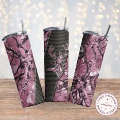 three pink camo tumblers with deer heads on them