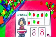 a child's calendar with apples on it