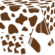 a cow print table cloth with brown spots