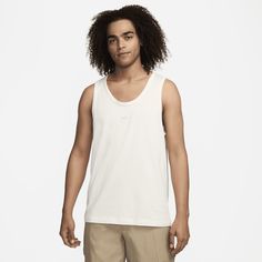 When the mercury starts to rise, nothing helps you beat the heat better than a tank top. The embroidered logo at the chest and heavyweight fabric on our Premium Essentials tank give just enough polish to keep you looking as good as you feel. Nike Sleeveless Streetwear Tops, Nike Sleeveless Tops For Streetwear, Nike Cotton Athleisure Tank Top, Nike Cotton Tank Top Athleisure, Nike Cotton Tank Top For Athleisure, Nike Cotton Tank Top For Workout, Nike Casual Moisture-wicking Tank Top, Moisture-wicking Cotton Tank Top For Streetwear, Functional Cotton Tank Top