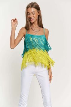 The Fringe Overlay Cross Straps Party Cami Top combines playful flair with elegant styling for a standout look at any occasion. Featuring a fringe overlay detail that adds movement and texture, this cami top exudes a festive vibe perfect for parties and events. The cross straps add a stylish touch to the neckline, while the cami silhouette offers a flattering fit. Model is wearing SmallHeight: 5'9"Bust : 32BWaist : 24"Hips : 34" Style: Chic Print / Pattern: Fringe Silhouette: Cami Fit: Regular E Chic Fringe Beach Tops, Multicolor Stretch Cami Top, Party Fringe Sleeveless Tank Top, Beach Crop Top With Fringe Detail, Summer V-neck Tops With Fringe Details, Denim Short Dresses, Black Dress Outfits, Crop Top Shirts, Activewear Sets