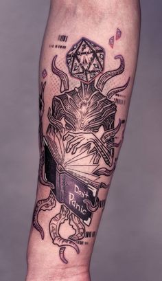 a person with a book tattoo on their leg