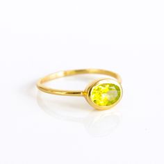 You'll fall in love with the stunning green color of this Peridot Quartz ring. This is a perfectly sized oval to compliment any collection. Popular as a birthday gift for those August babes and Peridot lovers alike. This stone is beautifully faceted and bezel set in a 925 sterling silver band or plated with 18k vermeil gold. Gemstone is approximately 8 x 6mm.Band has 925 stamp on inside.Please note that each ring is handmade and there may be some slight variations from listing photo.Available in Yellow Oval Birthstone Promise Ring, Oval May Birthstone Ring Gift, Lime Green Birthstone Ring As Gift, Oval Birthstone Ring Gift, May Birthstone Ring For Gift, Oval Yellow Gold Birthstone Anniversary Ring, Oval Yellow Birthstone Anniversary Ring, Yellow Oval Birthstone Anniversary Ring, Oval Green Gemstone Birthstone Ring