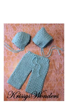 two crocheted baby pants and hat are shown