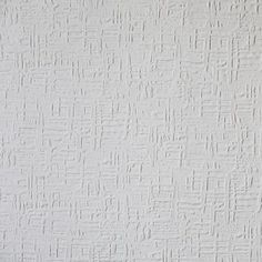 a white wall that has some kind of textured paint on it and is painted in different colors