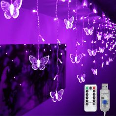 purple butterfly string lights hanging from the ceiling