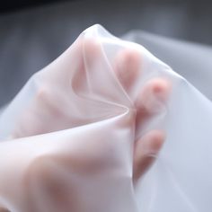 a person's hand is wrapped in plastic