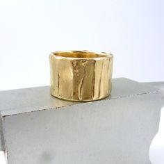 "Wide Bronze Ring, Rustic Bronze Ring, Boho Wide Gold Ring, Ancient Bronze Ring, Wide Gold Ring, \"Cakewalk Ring\" Multiple layers of bronze are used to create this unique surface texture Width is approximately 1/2 inch or a little more with organic edges Every ring is handmade. All of my rings are one of a kind and unique works of art. Each ring is unique and will be similar to the images but may vary slightly in width and pattern. Each ring has its own character with organic edges, undulating Wide Band Stackable Rings As Gift, Handmade Wide Band Ring For Promise, Unique Thick Band Jewelry Gift, Hand Cast Wide Band Ring Gift, Hand Cast Wide Band Jewelry Gift, Handmade Adjustable Wide Band Stackable Rings, Handmade Wide Band Stackable Rings As Gift, Handmade Wide Band Ring Gift, Handmade Wide Band Ring For Gift