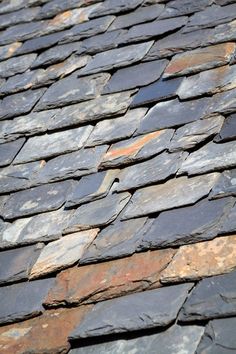 an old slate roof that has been cleaned and stained off with some paint on it