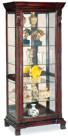 a wooden display case with glass doors and shelves filled with vases, bowls and other items