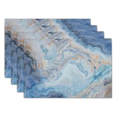 set of four placemats with blue and gold marble design on the front side