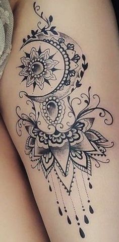 a woman's thigh with a tattoo on it