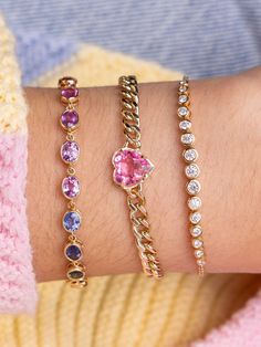 A gold thick design that matches your delicate wrist. A lovely single heart gemstone lays in a gold cuban bracelet, a mix of both bold and sweet. Cuban Bracelet, Heart Gemstone, Jewelry Lookbook, Pink Sapphire, Solid Gold, Lookbook, Sparkle, White Gold, Yellow Gold