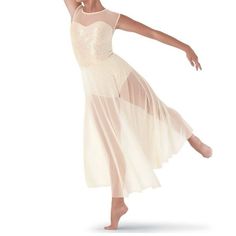 a woman in a white dress is dancing