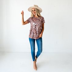 Rock your outfit in this super cute leopard print top! Pair this top with jeans, a denim jacket, and heels for a stylish look. Sizes: Small 0-4 Medium 6-8 Large 10-12 Material: 95% Polyester 5% Spandex Blend. Product Fit: Relaxed fit, True to size. Length of small is 26". Model info: 5'6" Wearing size small. Leopard Graphic, Top With Jeans, Cute Leopard, Leopard Print Top, Graphic Top, Print Top, Print Tops, Graphic Tee, Floral Tops