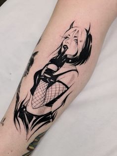 a black and white tattoo on the arm of a woman