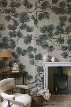 a living room with a fireplace and wall paper