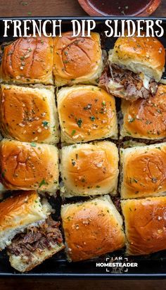 a tray full of french dip sliders