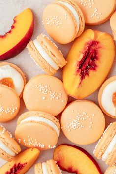 macaroons and peaches are arranged on a table