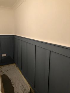 the walls are being painted with dark blue paint