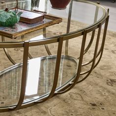 a glass and metal coffee table in a living room