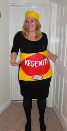 a woman in a vegemite costume holding up a sign