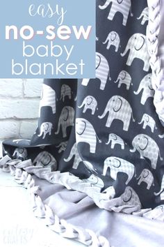 an easy no sew baby blanket with elephants on it and the words easy no sew