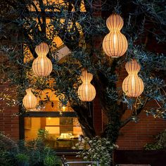 an outdoor area with chairs and lights hanging from the ceiling