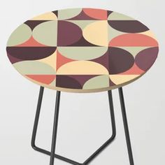 a small table with an abstract design on it