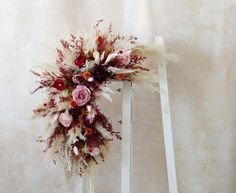 a white chair with a floral arrangement on it