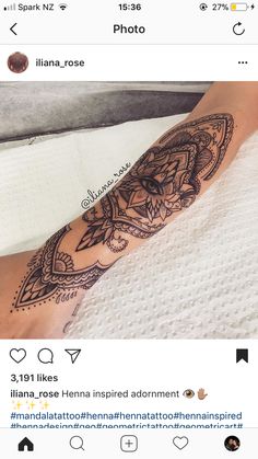 a person with a tattoo on their arm and leg in the middle of her hand