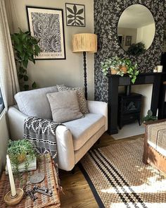 a living room filled with furniture and decor on top of hard wood floored floors