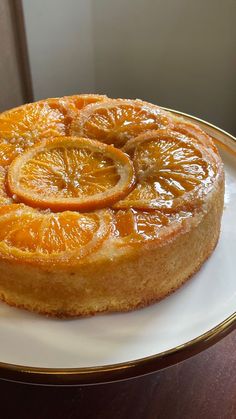 an orange upside down cake on a white plate