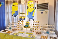 the dessert table is decorated with minion decorations