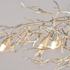 a chandelier with lights hanging from it's branches