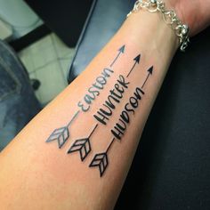 a woman's arm with an arrow tattoo on it that says cursive humor