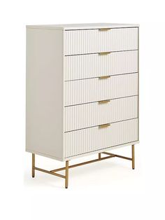 a white chest of drawers with gold handles on the top and bottom, against a white background