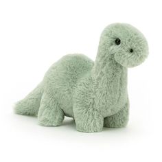 a green stuffed animal on a white background