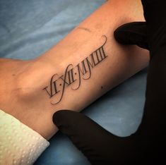 a person with a tattoo on their arm that reads, vexummn